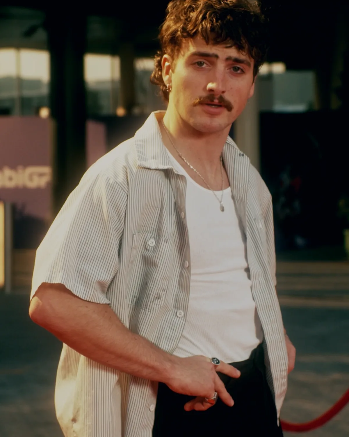 A glambot robotic camera arm working a red carpet